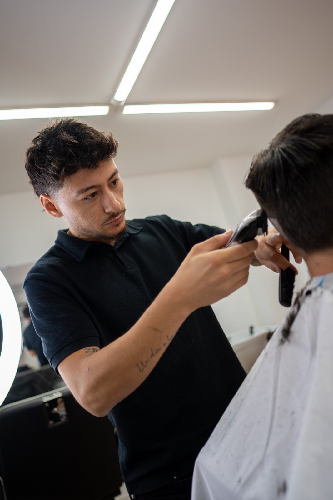 Corte en la barbería de El Carmen